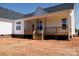Back porch featuring wooden railing and a ceiling fan at 4648 Simpson Rd, Edgemoor, SC 29712