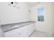 Well-lit bathroom vanity features granite countertops and ample storage at 4648 Simpson Rd, Edgemoor, SC 29712
