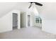 Carpeted bonus room featuring an attic ceiling, and two windows at 4648 Simpson Rd, Edgemoor, SC 29712
