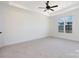 Spacious carpeted bedroom with neutral walls and a ceiling fan at 4648 Simpson Rd, Edgemoor, SC 29712