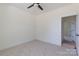 Cozy bedroom features neutral carpet, with an entrance leading to another room with hardwood floors at 4648 Simpson Rd, Edgemoor, SC 29712