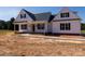 Charming new construction home with a covered porch and classic black shutters against a bright white exterior at 4648 Simpson Rd, Edgemoor, SC 29712
