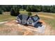 A beautiful new construction featuring a welcoming front porch and sleek black shutters is set on a large lot at 4648 Simpson Rd, Edgemoor, SC 29712