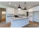 Eat in kitchen featuring granite countertops, stainless appliances and island with stainless sink at 4648 Simpson Rd, Edgemoor, SC 29712