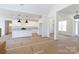Open-concept living space showcasing kitchen with granite counters, stainless appliances and bright, airy feel at 4648 Simpson Rd, Edgemoor, SC 29712