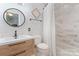 Bathroom features wood vanity, white tile, and modern fixtures at 4877 River Hills Dr, Denver, NC 28037