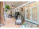 Covered patio with ceiling fan, outdoor furniture and french doors leading to inside at 4877 River Hills Dr, Denver, NC 28037