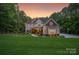 Stunning two-story home with a manicured lawn and inviting curb appeal at 4877 River Hills Dr, Denver, NC 28037