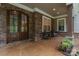 Cozy front porch with a stone facade and seating area at 4877 River Hills Dr, Denver, NC 28037