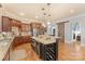 Gourmet kitchen featuring an island with wine rack and stainless steel appliances at 4877 River Hills Dr, Denver, NC 28037