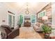 Cozy living room with vaulted ceilings, a wood-paneled accent wall, and plenty of natural light at 4877 River Hills Dr, Denver, NC 28037