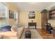 Comfortable living room with built-in desk and shelves, a couch and a flat screen TV at 4877 River Hills Dr, Denver, NC 28037