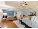 Spacious main bedroom features hardwood floors, tray ceiling, seating area and ensuite bath at 4877 River Hills Dr, Denver, NC 28037