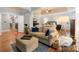 Cozy main bedroom sitting area boasts hardwood floors and ample natural light at 4877 River Hills Dr, Denver, NC 28037
