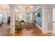 Comfortable bedroom sitting area with hardwood floors, tray ceiling and natural light at 4877 River Hills Dr, Denver, NC 28037