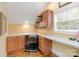 Home office featuring built-in desk, storage, and window with view of the backyard at 4877 River Hills Dr, Denver, NC 28037