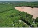 Expansive land with forest and cleared area and a communications tower at 4901 Pine Oaks Dr, Monroe, NC 28112