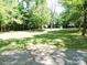 Expansive backyard with mature trees and lush green lawn at 4901 Pine Oaks Dr, Monroe, NC 28112