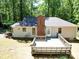 Aerial view of the home's backyard showcasing a spacious deck and well-maintained lawn at 4901 Pine Oaks Dr, Monroe, NC 28112