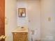 Functional bathroom with vanity and mirror, ready for renovation at 4901 Pine Oaks Dr, Monroe, NC 28112