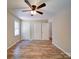 Bedroom with ceiling fan, new floors, and closet at 4901 Pine Oaks Dr, Monroe, NC 28112