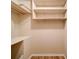 Organized closet with built-in shelving and a hanging rod, perfect for storage at 4901 Pine Oaks Dr, Monroe, NC 28112
