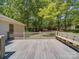Spacious back deck with railing offering ample space for outdoor seating and entertainment at 4901 Pine Oaks Dr, Monroe, NC 28112