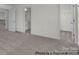 Spacious bedroom with neutral carpet and views into bathroom and closet at 5149 Tommy Ln # 1102, Stanley, NC 28164