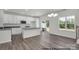 Bright kitchen featuring white cabinets, stainless appliances, and an island at 5149 Tommy Ln # 1102, Stanley, NC 28164