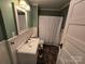 The bathroom has a vanity, mirror, toilet, and tub with shower at 5501 Barrier Rd, Concord, NC 28025
