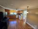 This kitchen has wood cabinets, and white appliances, plus vinyl flooring at 5501 Barrier Rd, Concord, NC 28025