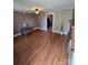 Spacious living room boasting beautiful hardwood floors and a brick fireplace, perfect for cozy evenings at 5501 Barrier Rd, Concord, NC 28025