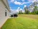 Green backyard featuring a patio, outdoor seating, and grill, perfect for relaxing at 584 Lamorak Pl, Richburg, SC 29729