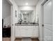 Bright bathroom with modern vanity and large mirror at 584 Lamorak Pl, Richburg, SC 29729