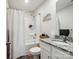 Clean bathroom featuring a shower-tub combo and granite vanity countertop at 584 Lamorak Pl, Richburg, SC 29729