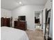 Comfortable bedroom with view to living area, complete with dressers at 584 Lamorak Pl, Richburg, SC 29729