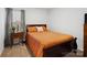 Cozy bedroom with warm color scheme, side table, and window at 584 Lamorak Pl, Richburg, SC 29729