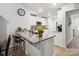 Kitchen island with granite countertops, bar stool seating and stainless steel appliances at 584 Lamorak Pl, Richburg, SC 29729