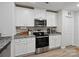 Kitchen featuring modern appliances, ample cabinet space, and granite countertops at 584 Lamorak Pl, Richburg, SC 29729