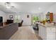 Bright open-concept living area featuring a sliding glass doors that provide seamless indoor-outdoor living at 584 Lamorak Pl, Richburg, SC 29729