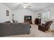 Cozy living room featuring plush seating, fireplace, and neutral decor at 584 Lamorak Pl, Richburg, SC 29729