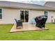 Back patio featuring outdoor seating and grill, ideal for outdoor entertaining at 584 Lamorak Pl, Richburg, SC 29729