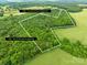 Aerial view of the property showing wooded acreage, offering privacy and potential for development at 5903 Wm Griffin Rd, Monroe, NC 28112