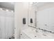 Clean bathroom featuring a shower, single sink vanity, and white cabinets at 5903 Wm Griffin Rd, Monroe, NC 28112