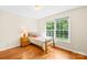 Bright bedroom features hardwood flooring, large windows, and natural light at 5903 Wm Griffin Rd, Monroe, NC 28112