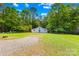 Detached garage with ample yard space and tree lined background at 5903 Wm Griffin Rd, Monroe, NC 28112
