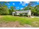 Ranch-style home with manicured lawn and landscaping at 5903 Wm Griffin Rd, Monroe, NC 28112