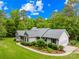 Charming ranch-style home with lush landscaping, attached garage, and well-manicured lawn at 5903 Wm Griffin Rd, Monroe, NC 28112