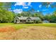 Charming ranch home exterior with front lawn and detached garage at 5903 Wm Griffin Rd, Monroe, NC 28112