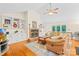 Spacious living room featuring a brick fireplace, built-in shelves, and hardwood floors at 5903 Wm Griffin Rd, Monroe, NC 28112